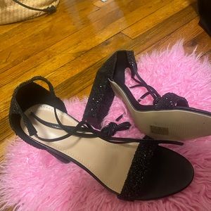 These are black heels with sequins that were never worn